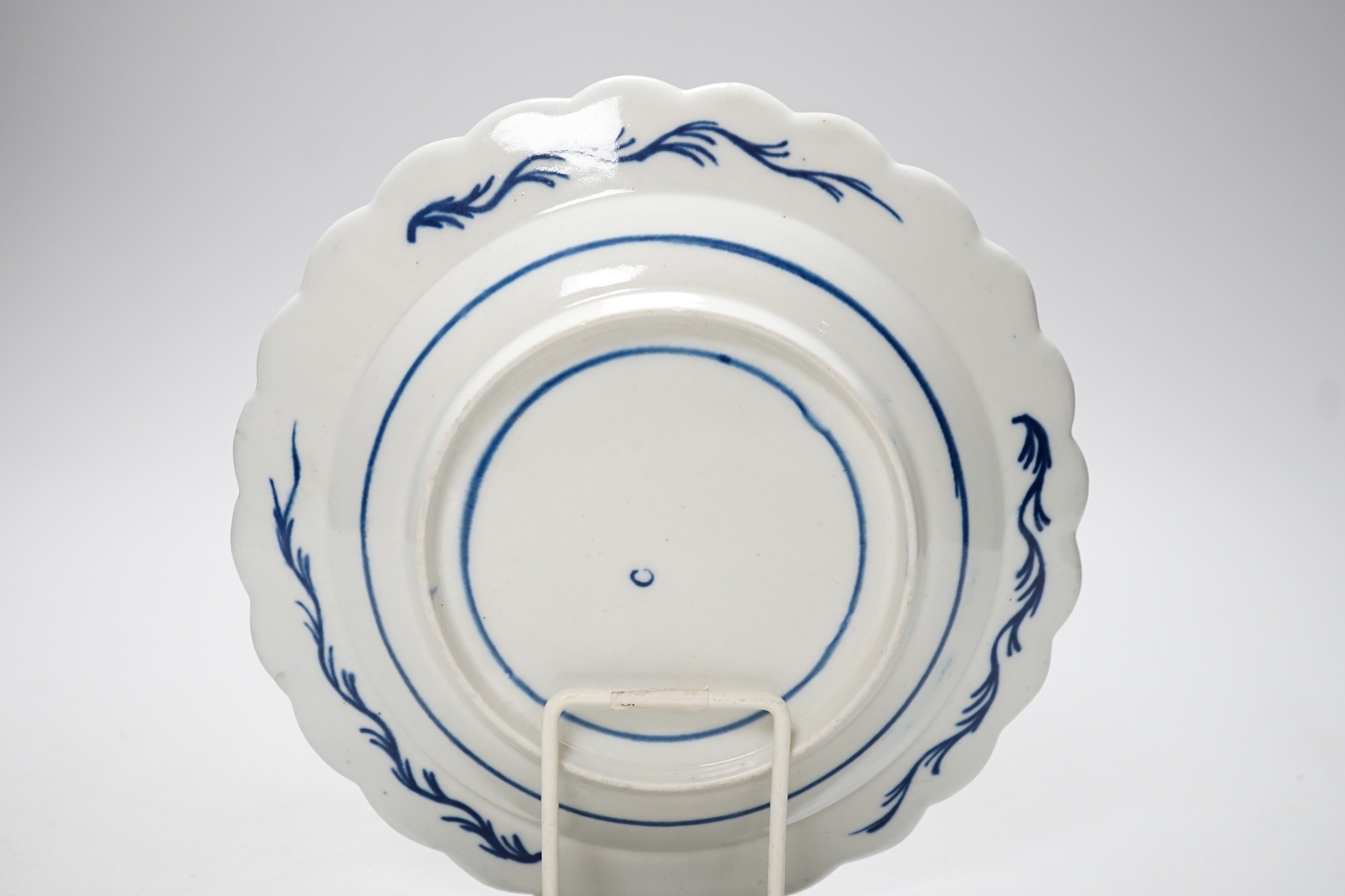 An 18th century Caughley plate painted with Scholars Rock, C mark, verso, 18cm.